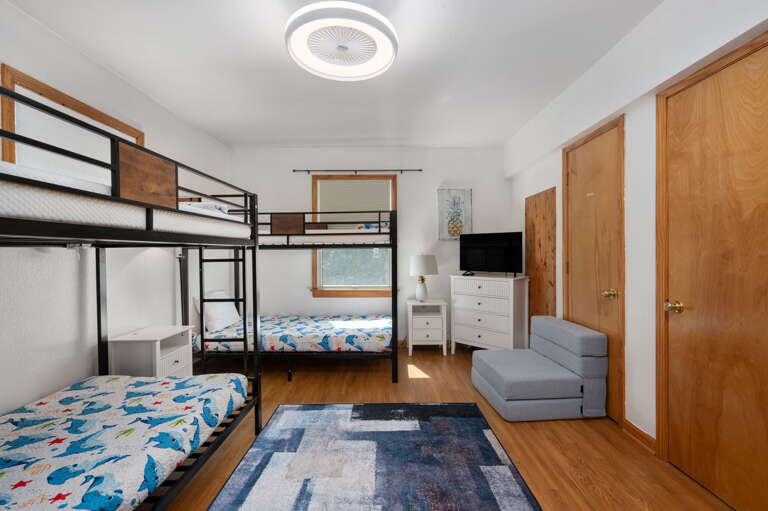 With room for everyone, enjoy this bunk room equipped with a television and games for for kids or adults of all ages.