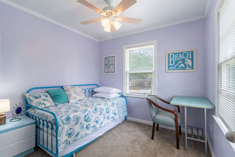 Twin bed with twin trundle and work desk.