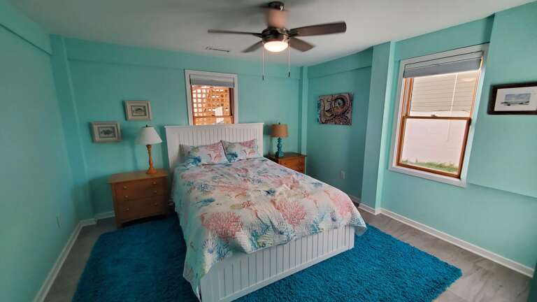 Ground level bedroom with Queen