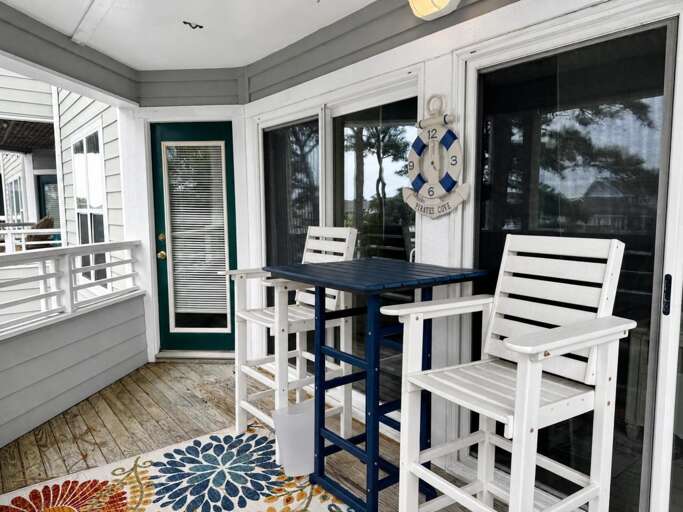 Rear Covered Porch with Table and Chairs