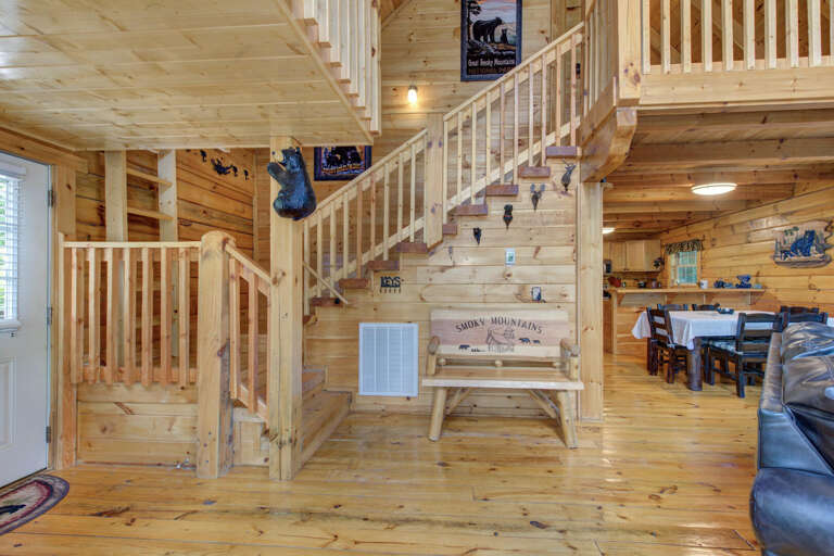 Wooden Cabin Interior With Stairs And Living Space