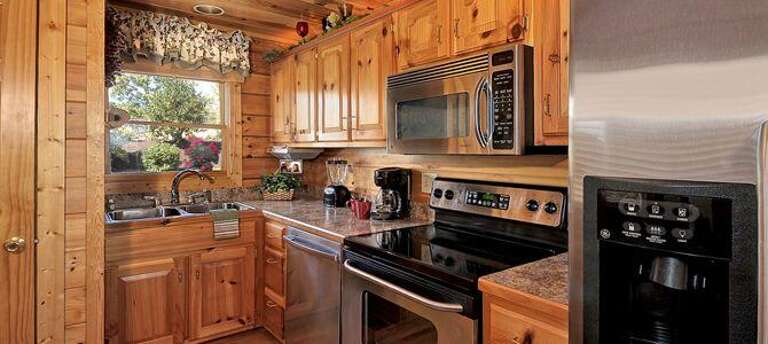 Upgraded Stainless Steel Kitchen with under-cabinet Cable TV-DVD-AM/FM, water/ice Dispenser & attached Laundry Closet Upgraded Stainless Steel Kitchen with under-cabinet Cable TV-DVD-AM/FM, water/ice Dispenser & attached Laundry Closet