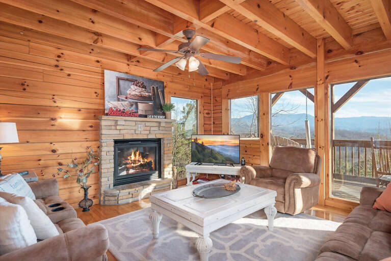 Wood-paneled Room With A Fireplace, Overlooking Mountains