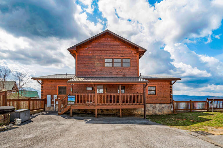 Wooden Vacation Rental With Vast Veranda Under Vibrant Skies
