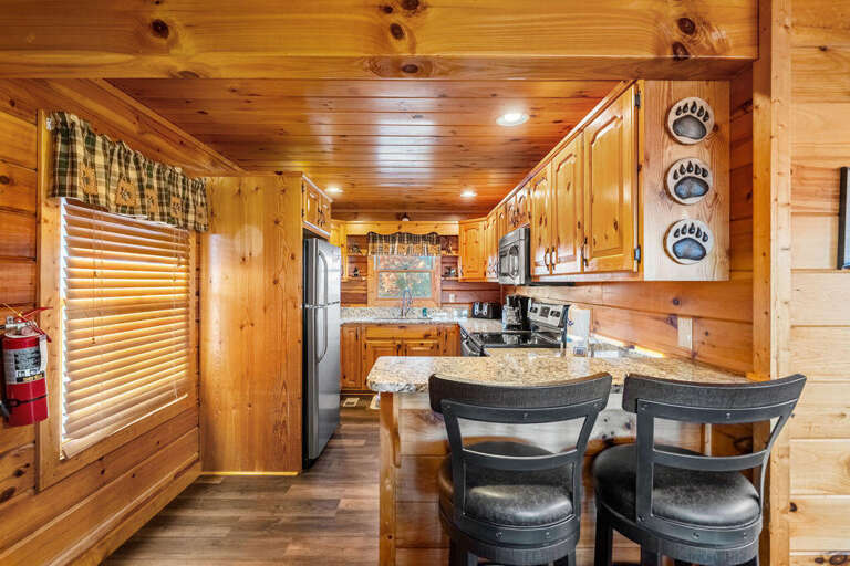 Wood-lined Interior With Kitchen And Bar Stools