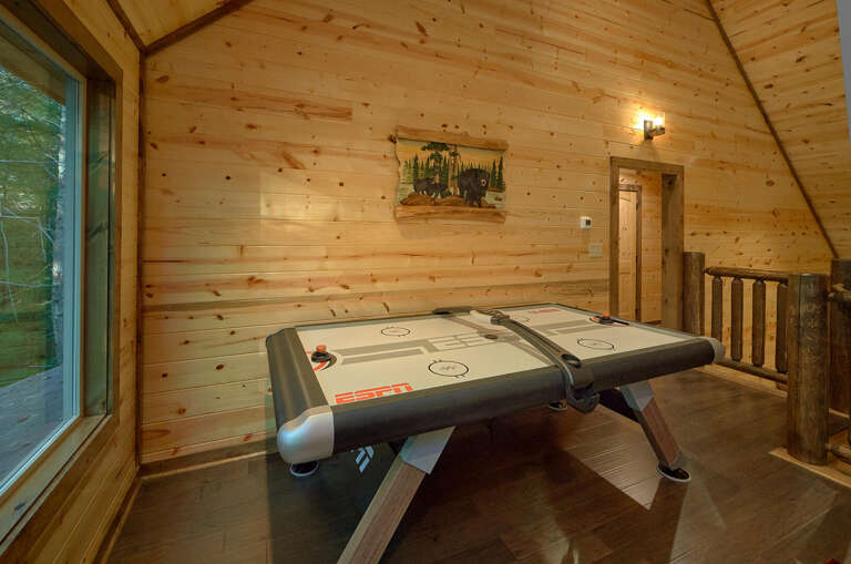 Wooden Walls With Air Hockey Table And Window View
