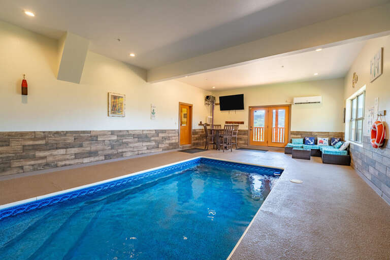 Indoor Pool Space With Seats And Sliding Doors