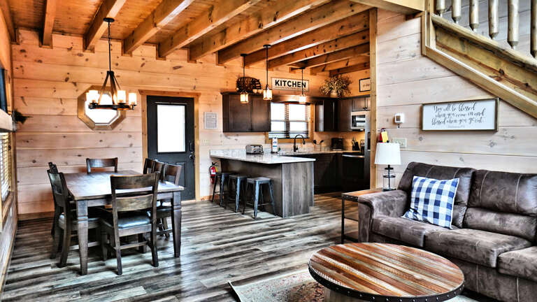 Rustic Wooden Cabin Interior With Kitchen And Living Space