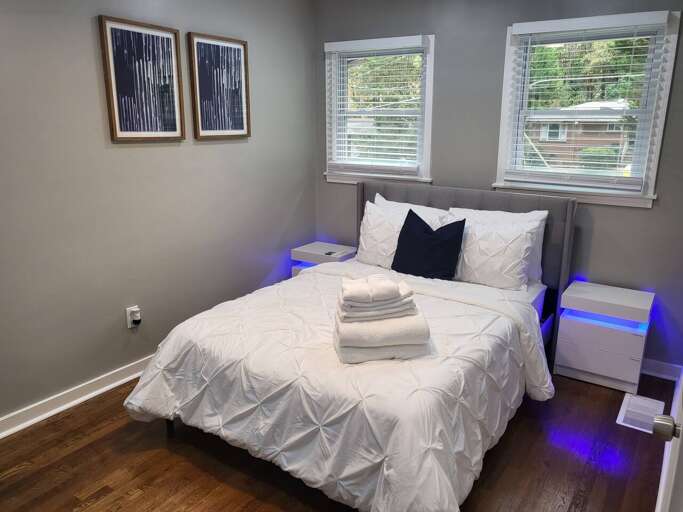 Modern Bedroom With White Bedding And Ambient Lighting