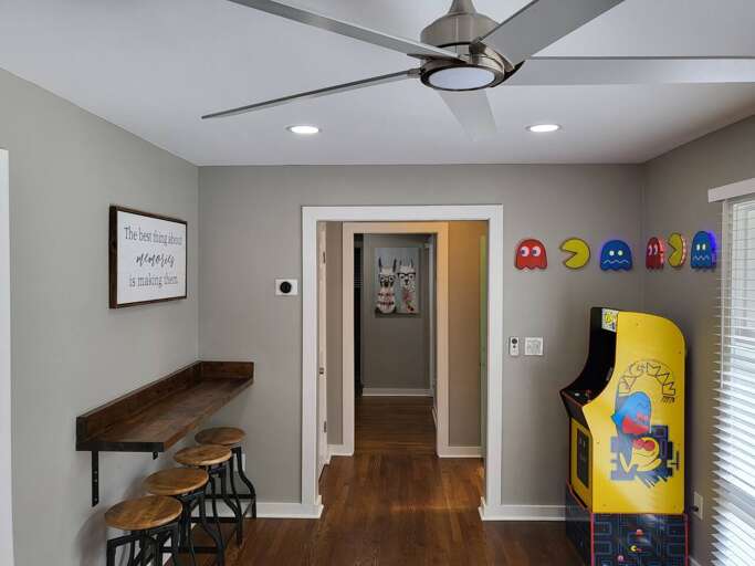 Interior Room With Arcade Machine And Wall Decor
