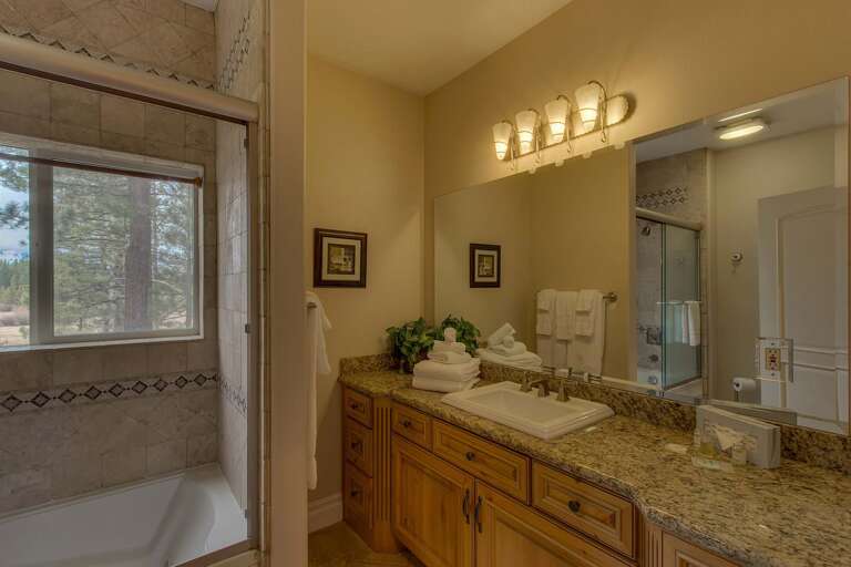 Bathroom with full bath and shower combo