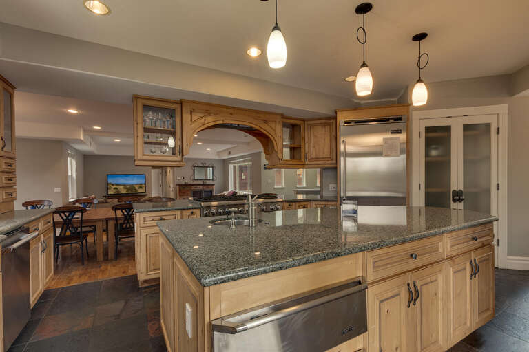 Kitchen area with large island and stainless-steel appliances