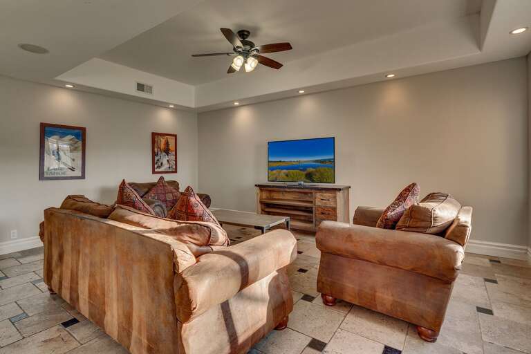 Living area with comfy couch and flat screen tv