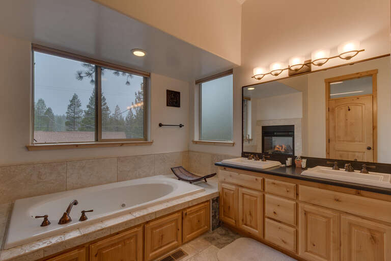 Bathroom with dual sinks and jetted tub Bathroom with dual sinks and jetted tub