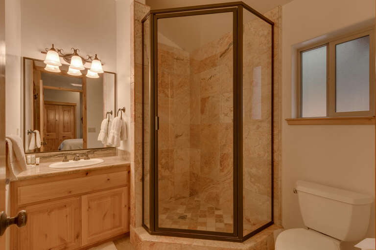 Bathroom with glass enclosed shower Bathroom with glass enclosed shower