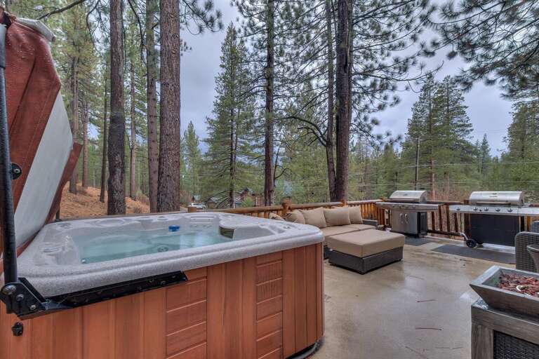 Deck with hot tub, outside furniture, and grill Deck with hot tub, outside furniture, and grill