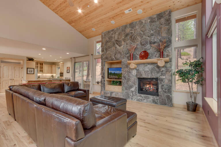 Living area with comfy couch, flat screen tv, and fireplace Living area with comfy couch, flat screen tv, and fireplace