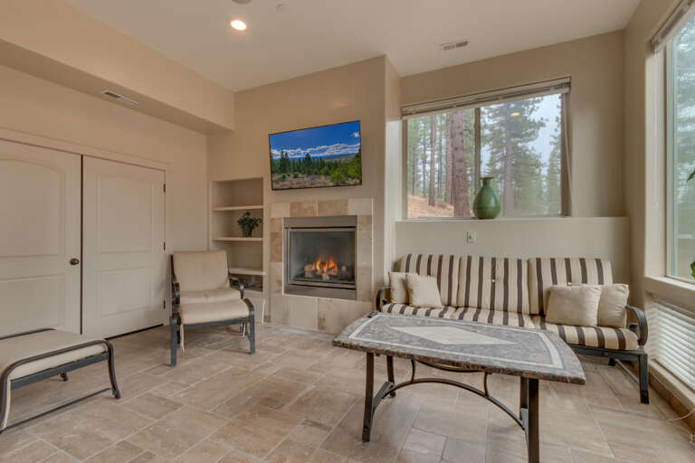Room with sofa, fireplace, and flat screen tv Room with sofa, fireplace, and flat screen tv