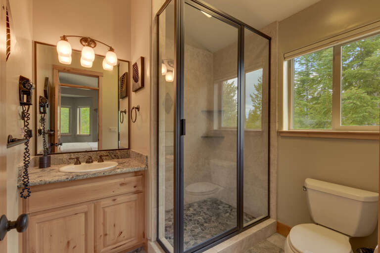 Bathroom with glass enclosed shower