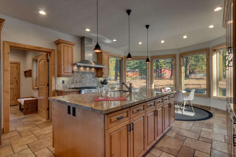 Kitchen area with stainless-steel appliances, and large island