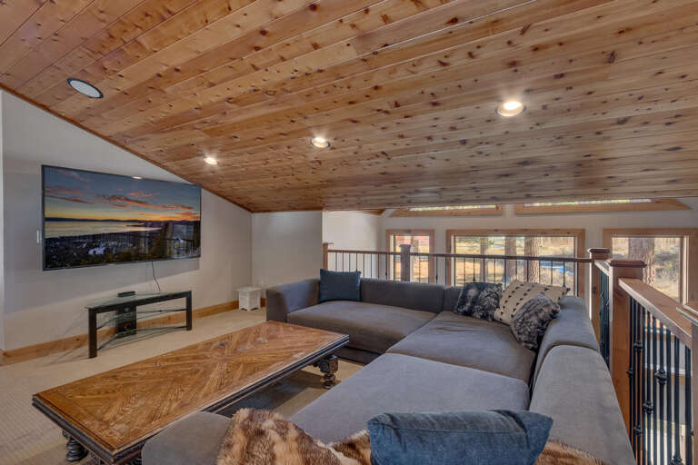 Recreation area with oversized flat screen tv and seating area