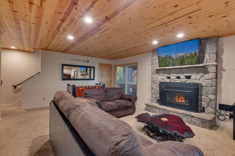 Recreation area with comfy seating, flat screen tv, and fireplace