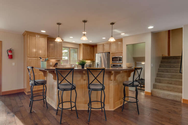 Kitchen area with stainless-steel appliances and large island