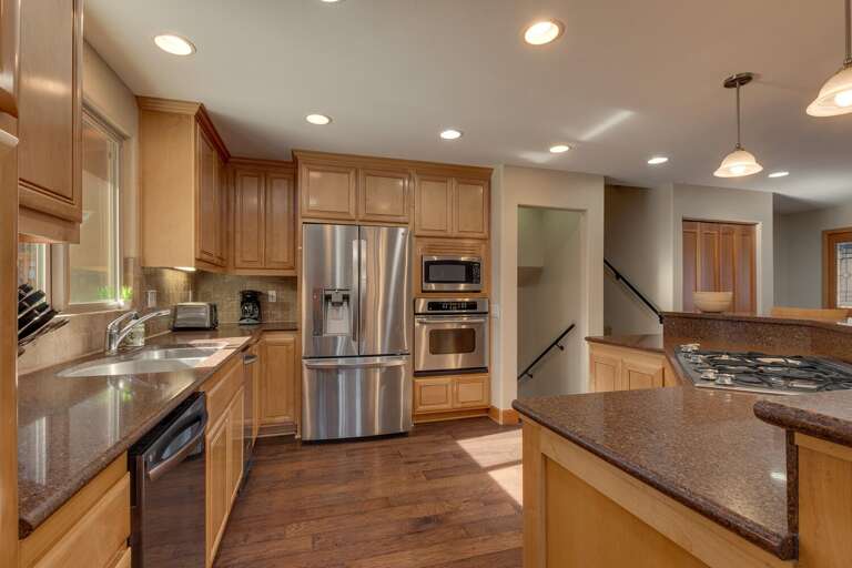 Kitchen area with stainless-steel appliances and large island