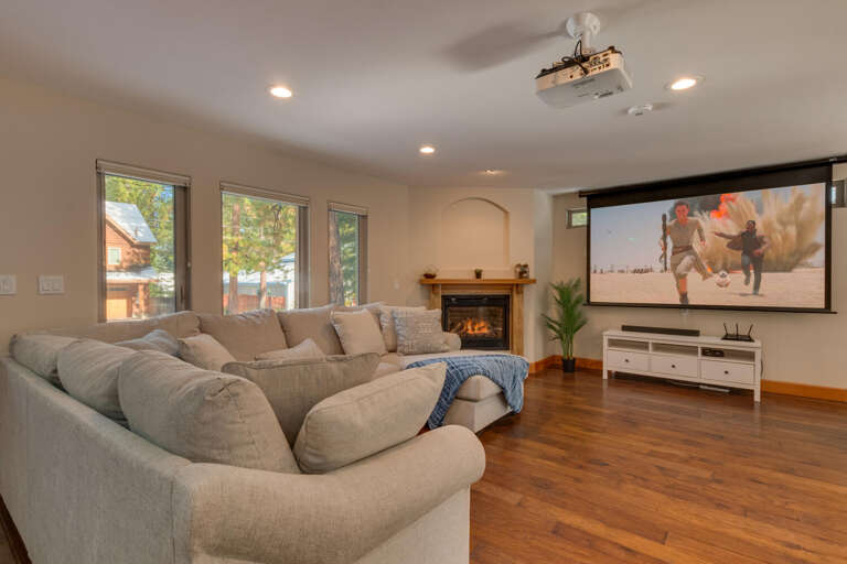 Living area with comfy sofa and theater projection