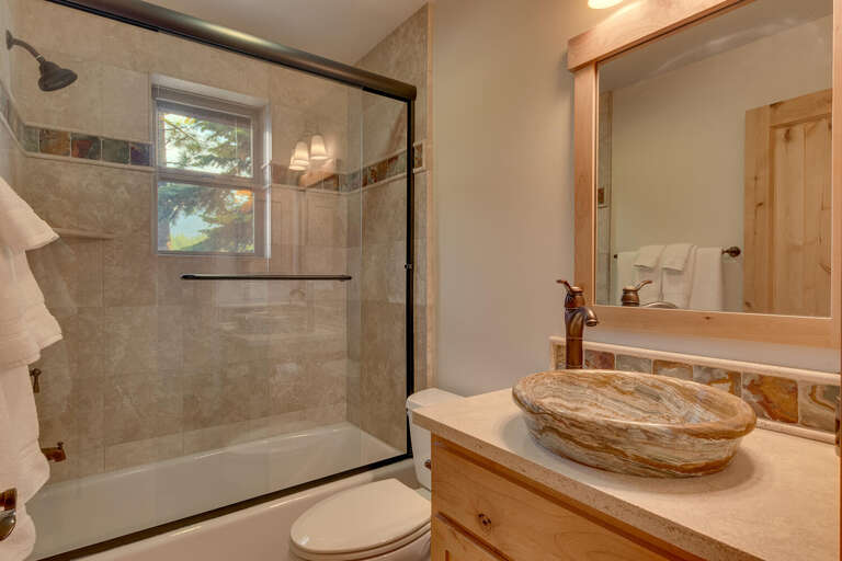 Bathroom with full bath and shower combo