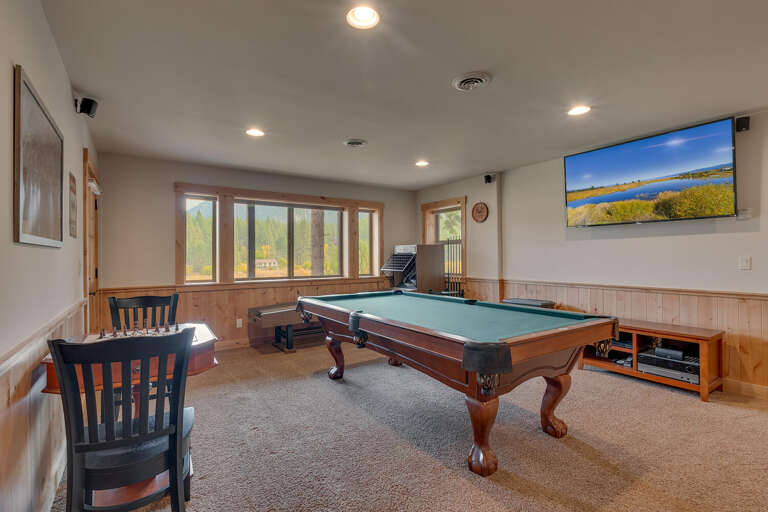 Recreation area with pool table, bubble hockey, Skee-ball, and poker table