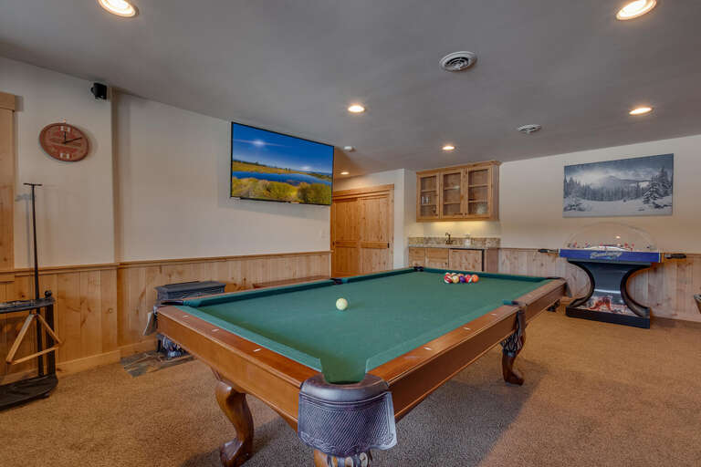 Recreation area with pool table, bubble hockey, Skee-ball, and poker table