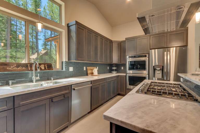 Kitchen area with stainless-steel appliances and large island