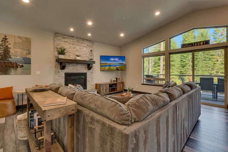 Living area with comfy sofa, fireplace, and flat screen tv
