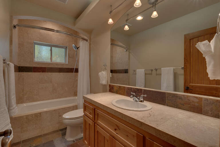 Bathroom with full bath and shower combo