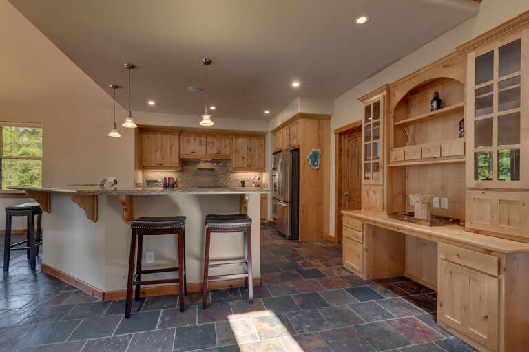Kitchen area with stainless steel appliances and large island