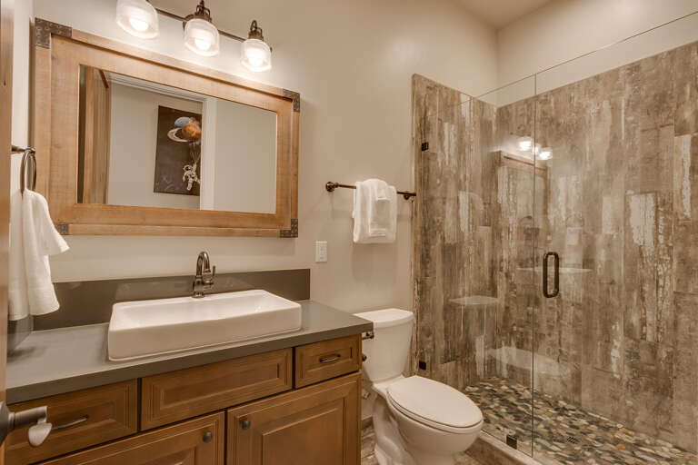 Bathroom with glass enclosed shower Bathroom with glass enclosed shower