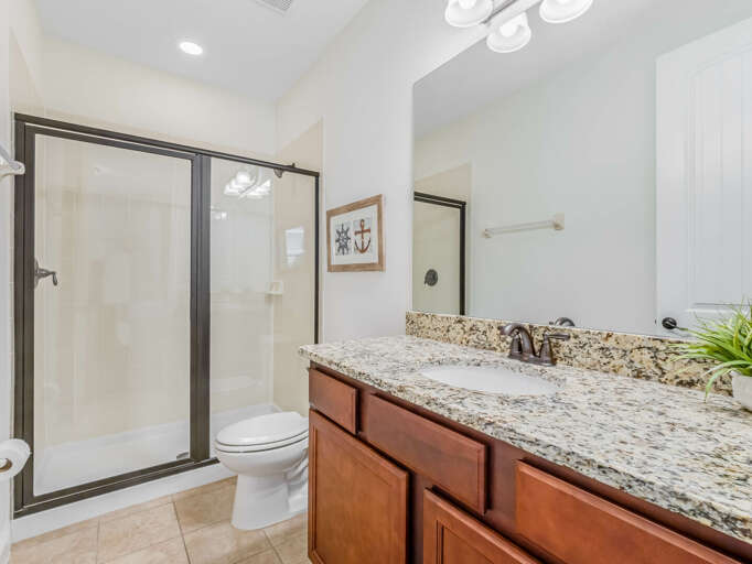 Bathroom with glass enclosed shower Bathroom with glass enclosed shower