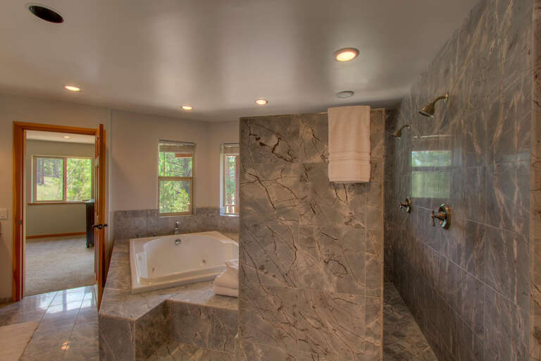 Bathroom with stone encased shower