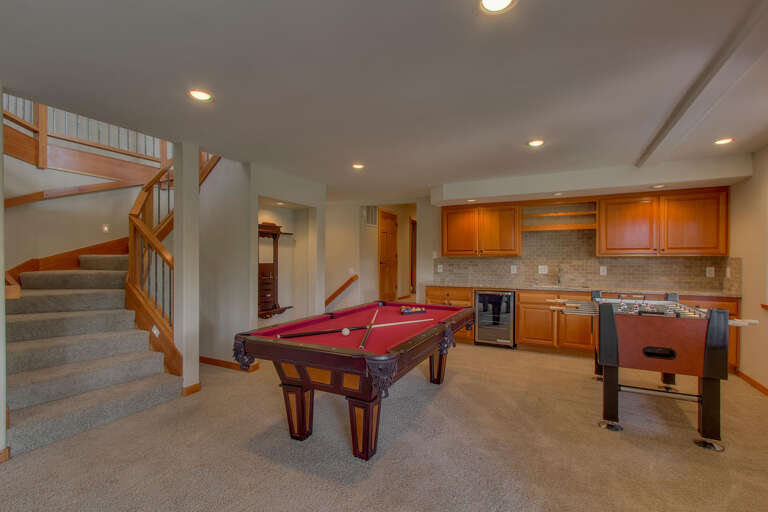 Game room with pool table and foosball