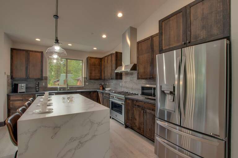 Kitchen area with stainless-steel appliances and spacious island