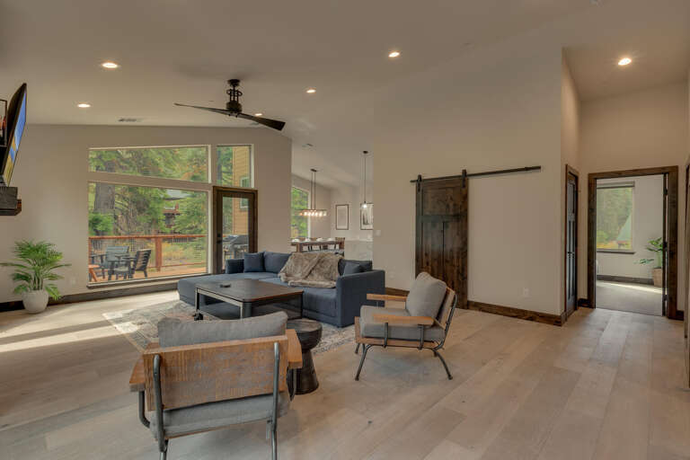 Living area with contemporary furniture, fireplace, and flat screen tv