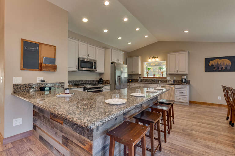 Kitchen area with stainless-steel appliances and spacious island