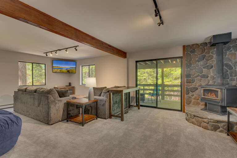 Room with seating area, flat screen tv, and fireplace Room with seating area, flat screen tv, and fireplace