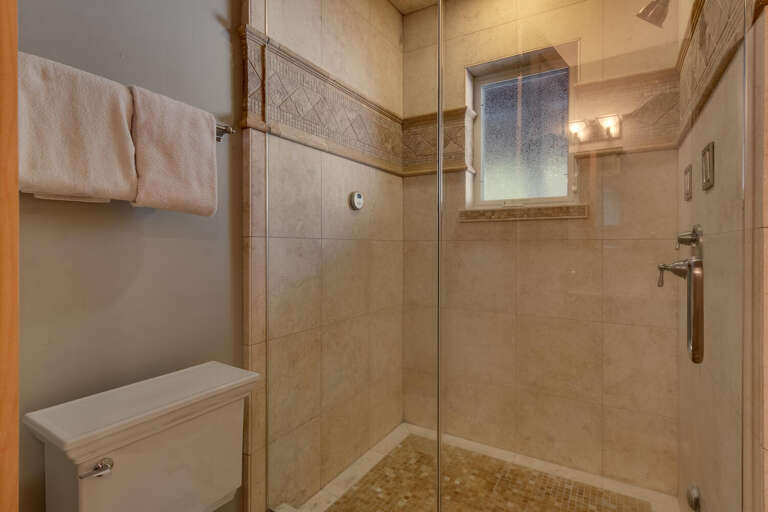 Bathroom with glass enclosed shower