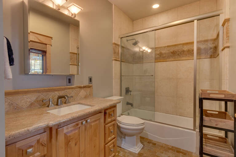 Bathroom with glass enclosed sink