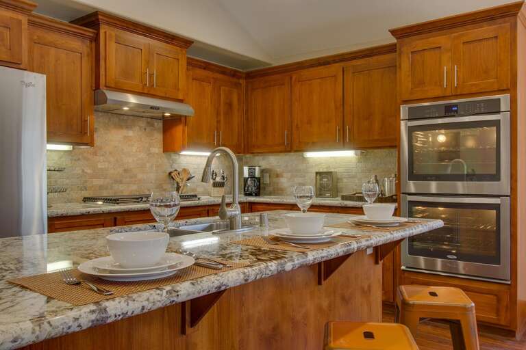 Kitchen area with stainless-steel appliances, and spacious island Kitchen area with stainless-steel appliances, and spacious island