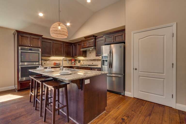 Kitchen area with stainless-steel appliances and spacious island