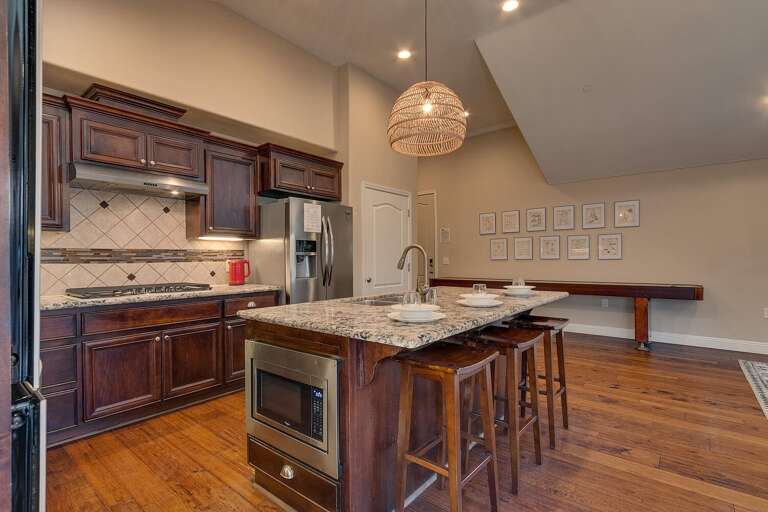 Kitchen area with stainless-steel appliances and spacious island