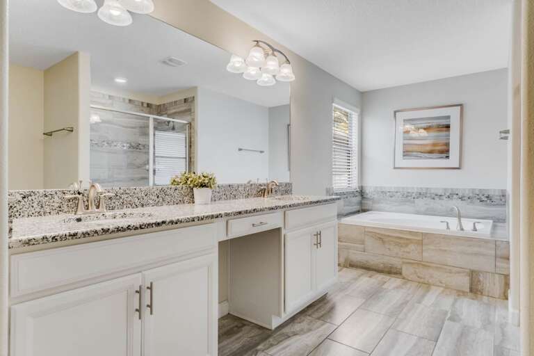 Bathroom with dual sinks and soaker tub